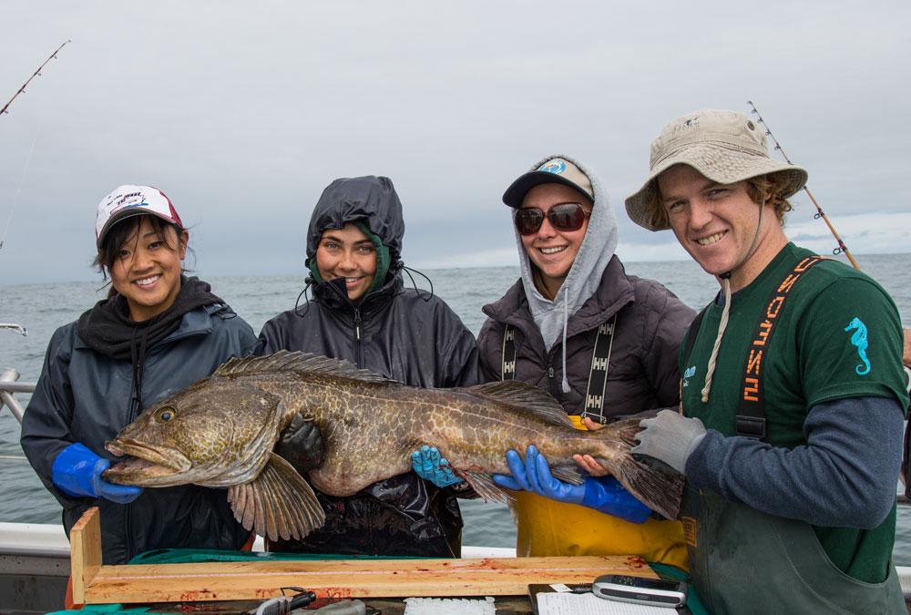 Students with large ling cod